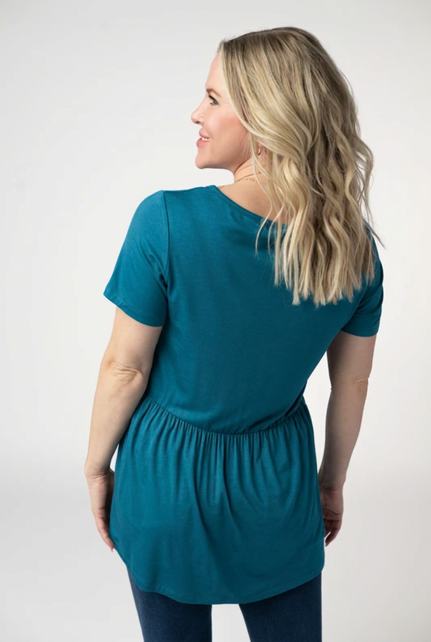 AI color mockup of the Sarah Ruffle Top in Teal, back view