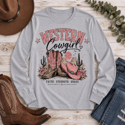 Western Cowgirl graphic long sleeve crewneck tee with pink boots, cowboy hat and desert design
