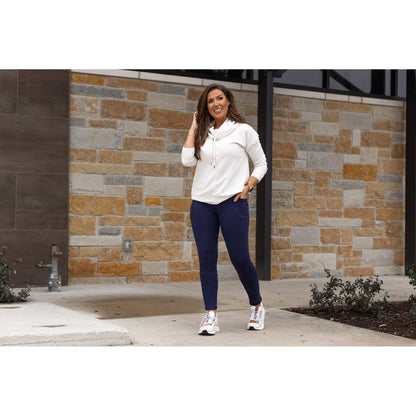 Buttery soft navy fleece leggings for women by Julia Rose.
High-waisted fleece leggings with side pockets in navy.