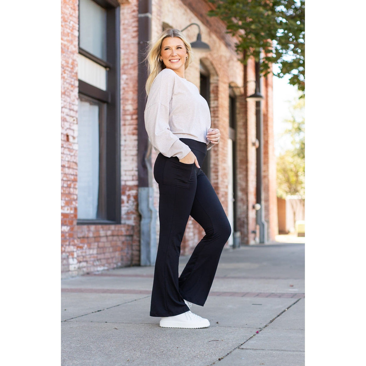 High-waisted black bootcut leggings by Julia Rose, Julia Rose women’s flared black leggings lifestyle image