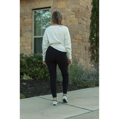 Soft black fleece-lined leggings with full length fit and pockets