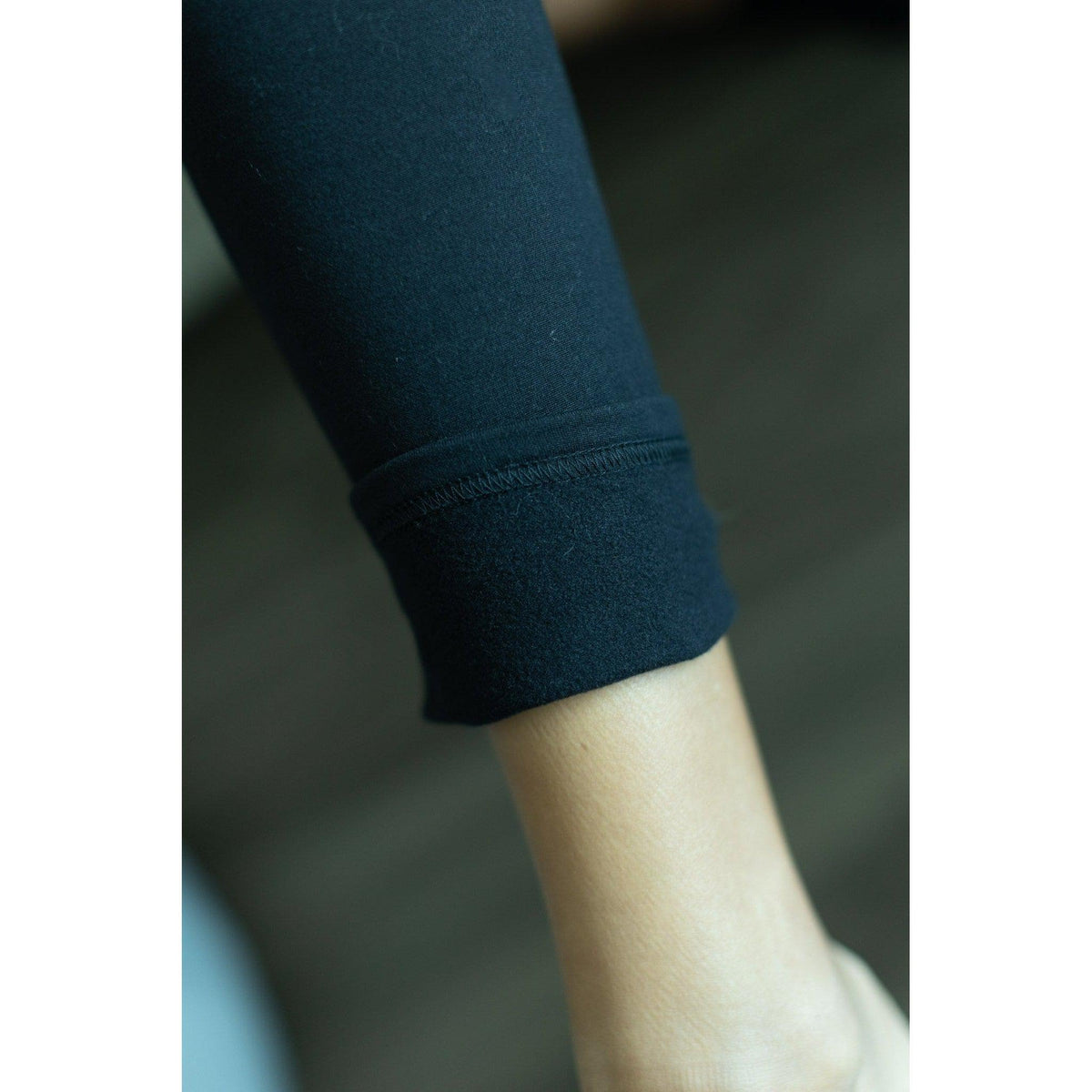 Soft black fleece-lined leggings with full length fit and pockets