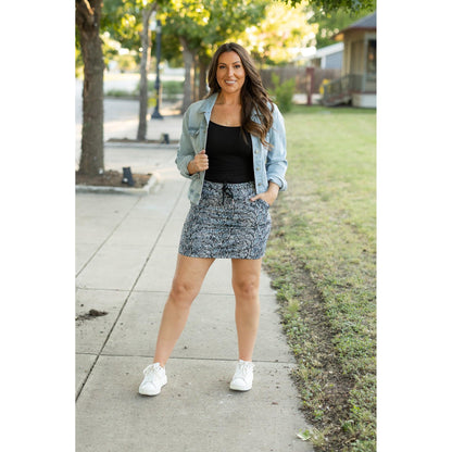 Julia Rose Sydney Snakeskin Jogger Skirt women’s boutique midi skirt front view, Woman wearing Julia Rose Sydney jogger style snakeskin skirt
