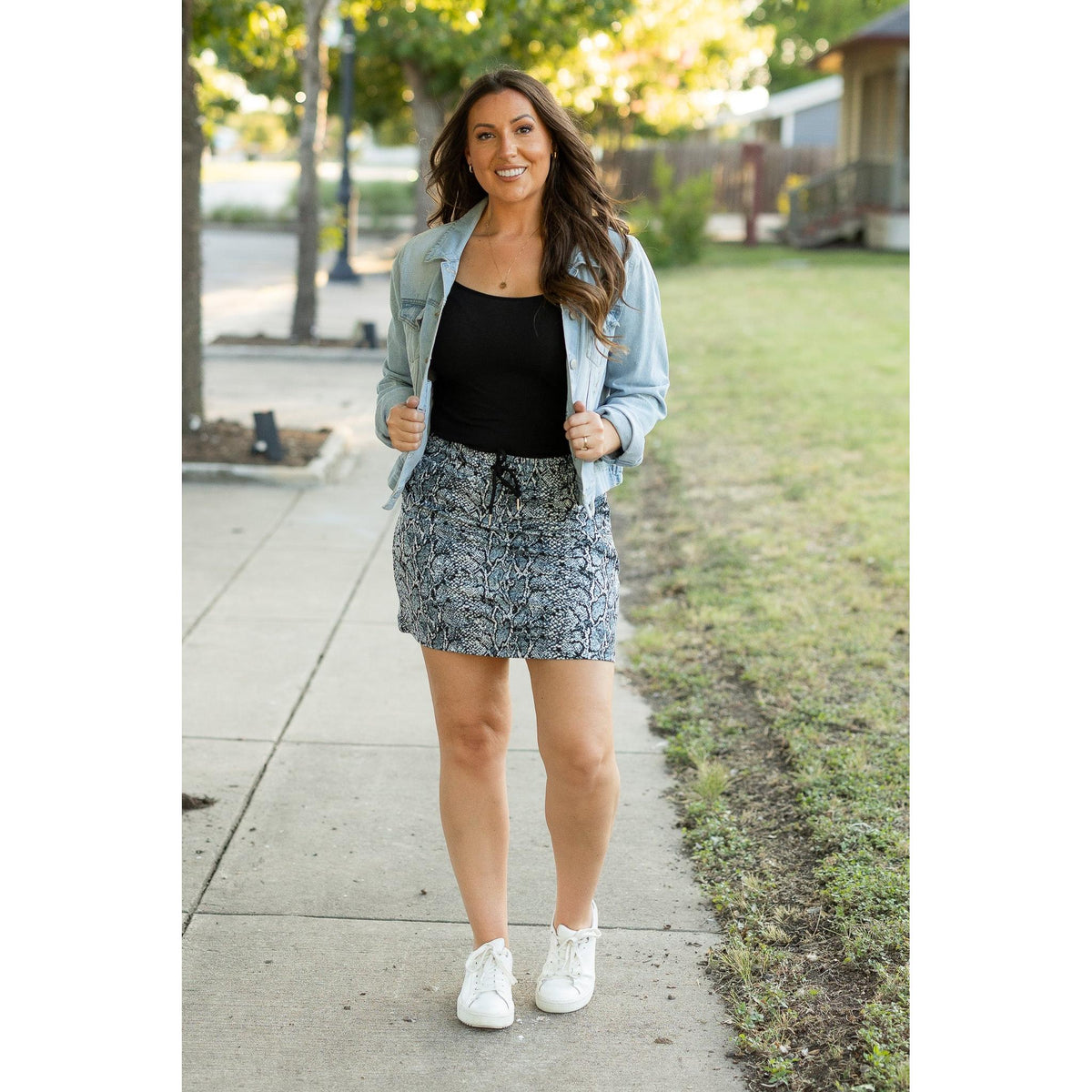 Julia Rose Sydney Snakeskin Jogger Skirt women’s boutique midi skirt front view, Woman wearing Julia Rose Sydney jogger style snakeskin skirt