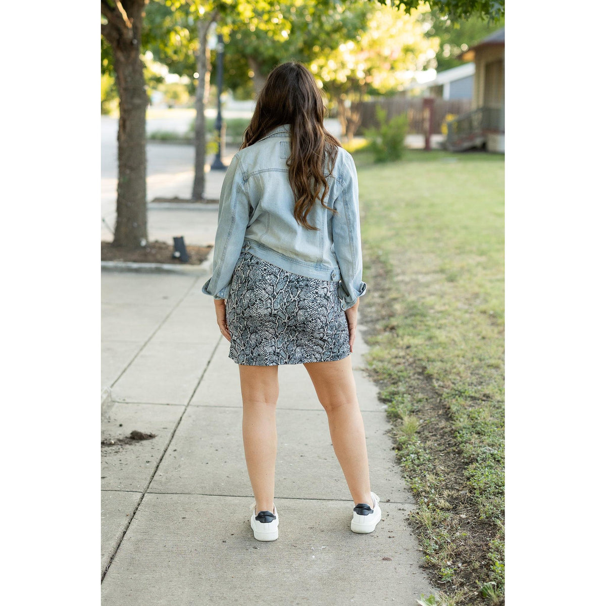 Julia Rose Sydney Snakeskin Jogger Skirt women’s boutique midi skirt front view, Woman wearing Julia Rose Sydney jogger style snakeskin skirt