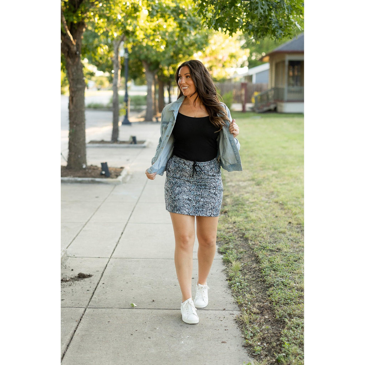 Julia Rose Sydney Snakeskin Jogger Skirt women’s boutique midi skirt front view, Woman wearing Julia Rose Sydney jogger style snakeskin skirt