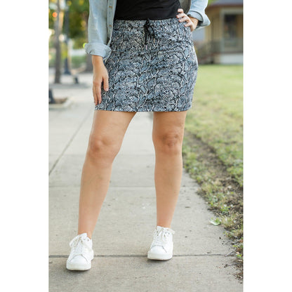 Julia Rose Sydney Snakeskin Jogger Skirt women’s boutique midi skirt front view, Woman wearing Julia Rose Sydney jogger style snakeskin skirt