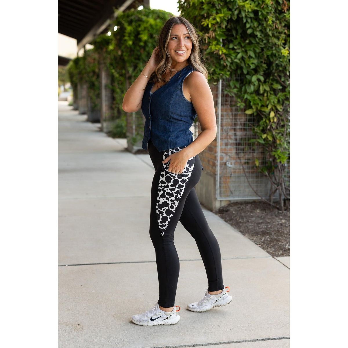 Julia Rose Carolina Cow Print Panel Leggings women’s boutique leggings front view, Woman wearing Julia Rose Carolina leggings with cow print panel detail