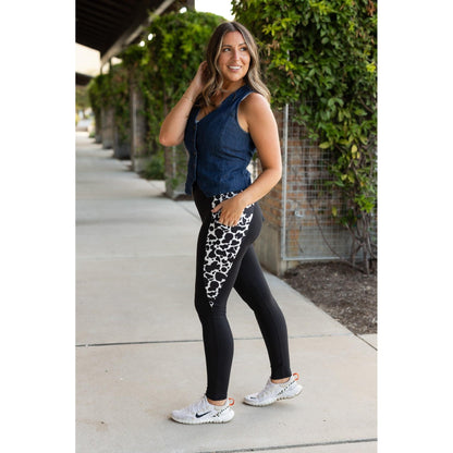 Julia Rose Carolina Cow Print Panel Leggings women’s boutique leggings front view, Woman wearing Julia Rose Carolina leggings with cow print panel detail