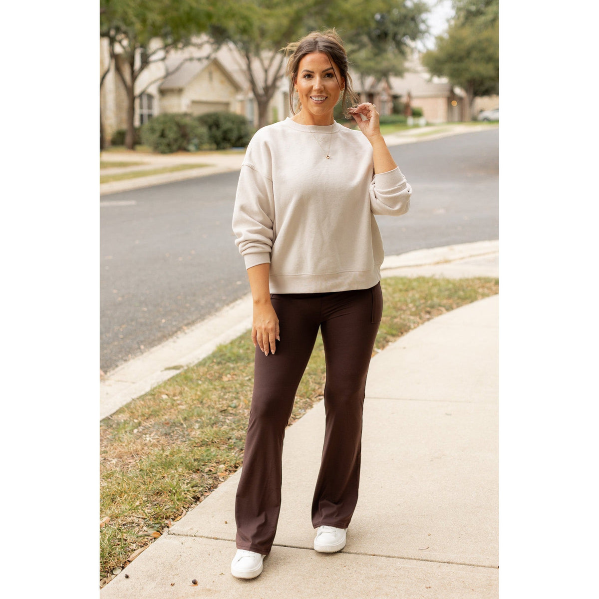 High-waisted brown bootcut leggings with pockets by Julia Rose, Julia Rose women’s brown flared leggings lifestyle image
