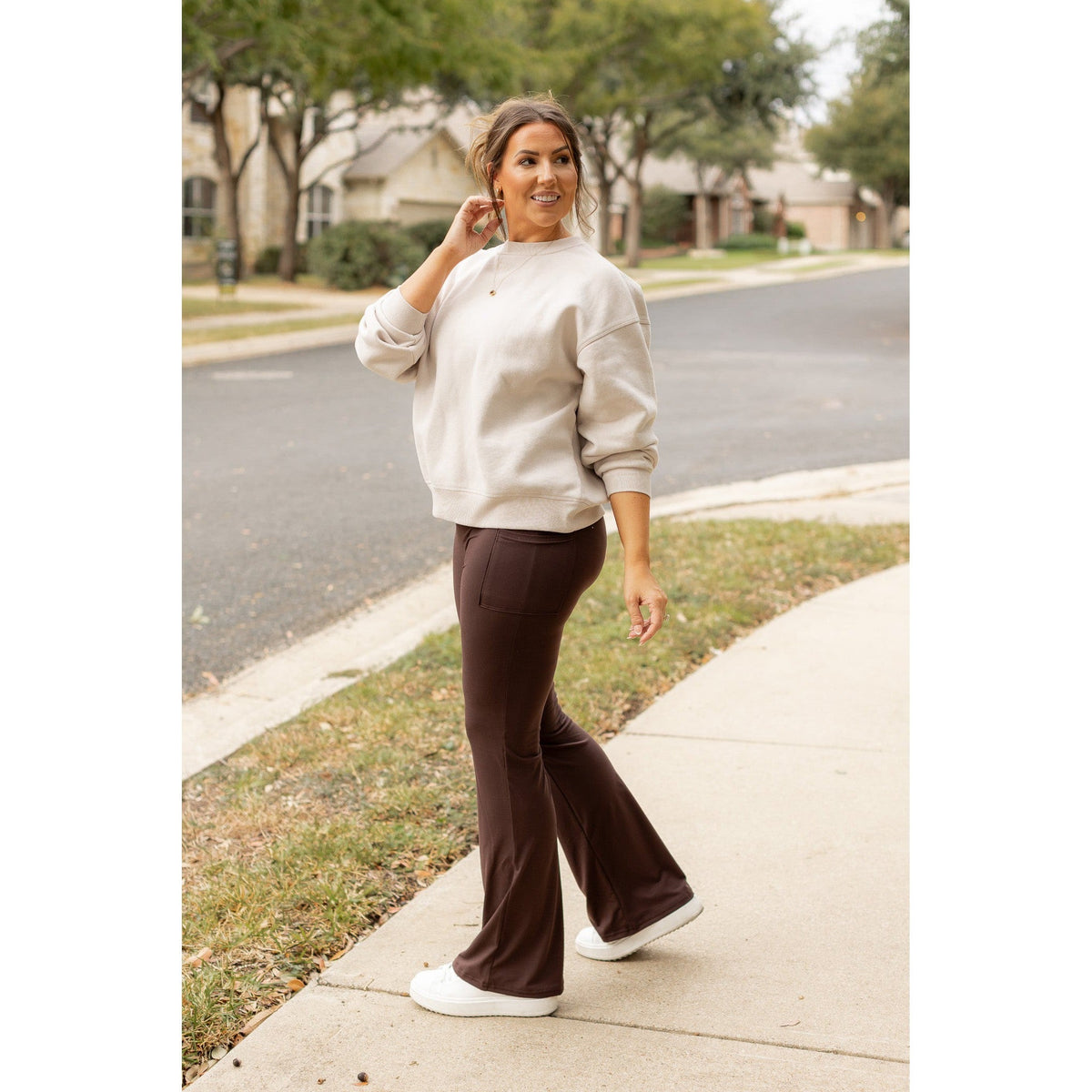 High-waisted brown bootcut leggings with pockets by Julia Rose, Julia Rose women’s brown flared leggings lifestyle image