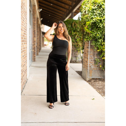 Women’s flowy velvet wide leg holiday pants. Velvet wide leg trousers styled for holiday outfits
