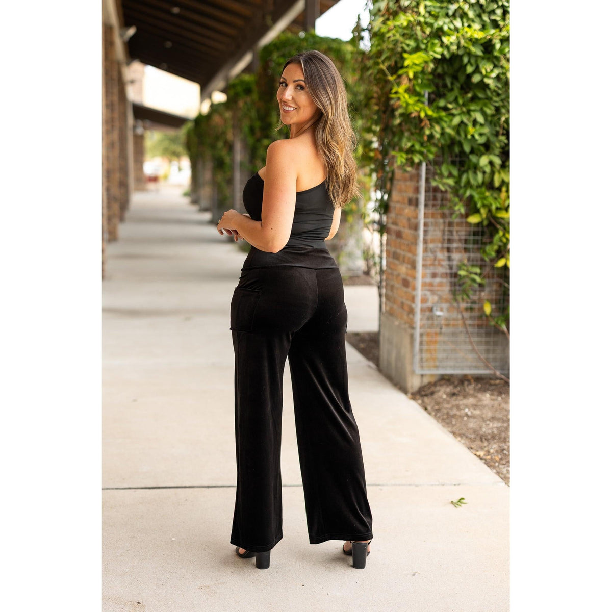 Women’s flowy velvet wide leg holiday pants. Velvet wide leg trousers styled for holiday outfits