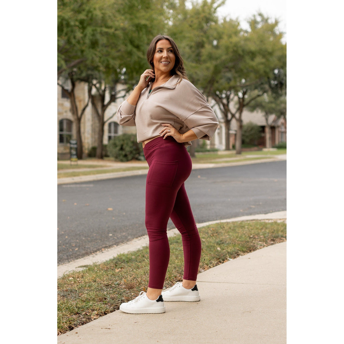High-waisted maroon crossover leggings with pockets by Julia Rose, Julia Rose women’s maroon full length leggings lifestyle image