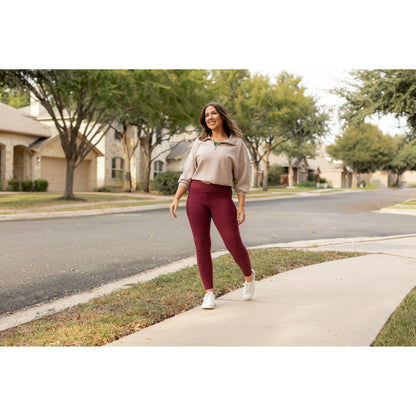 High-waisted maroon crossover leggings with pockets by Julia Rose, Julia Rose women’s maroon full length leggings lifestyle image