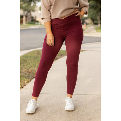 High-waisted maroon crossover leggings with pockets by Julia Rose, Julia Rose women’s maroon full length leggings lifestyle image