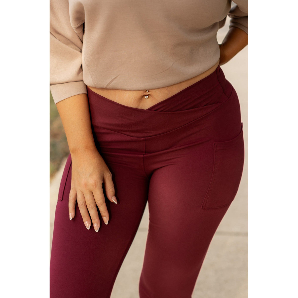 High-waisted maroon crossover leggings with pockets by Julia Rose, Julia Rose women’s maroon full length leggings lifestyle image