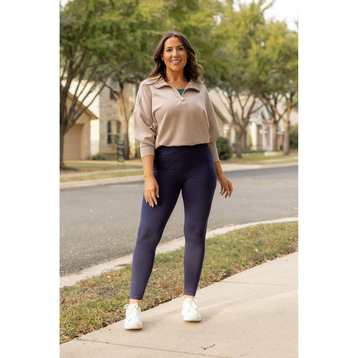 High-waisted navy crossover leggings with pockets by Julia Rose, Julia Rose women’s navy full length leggings lifestyle image