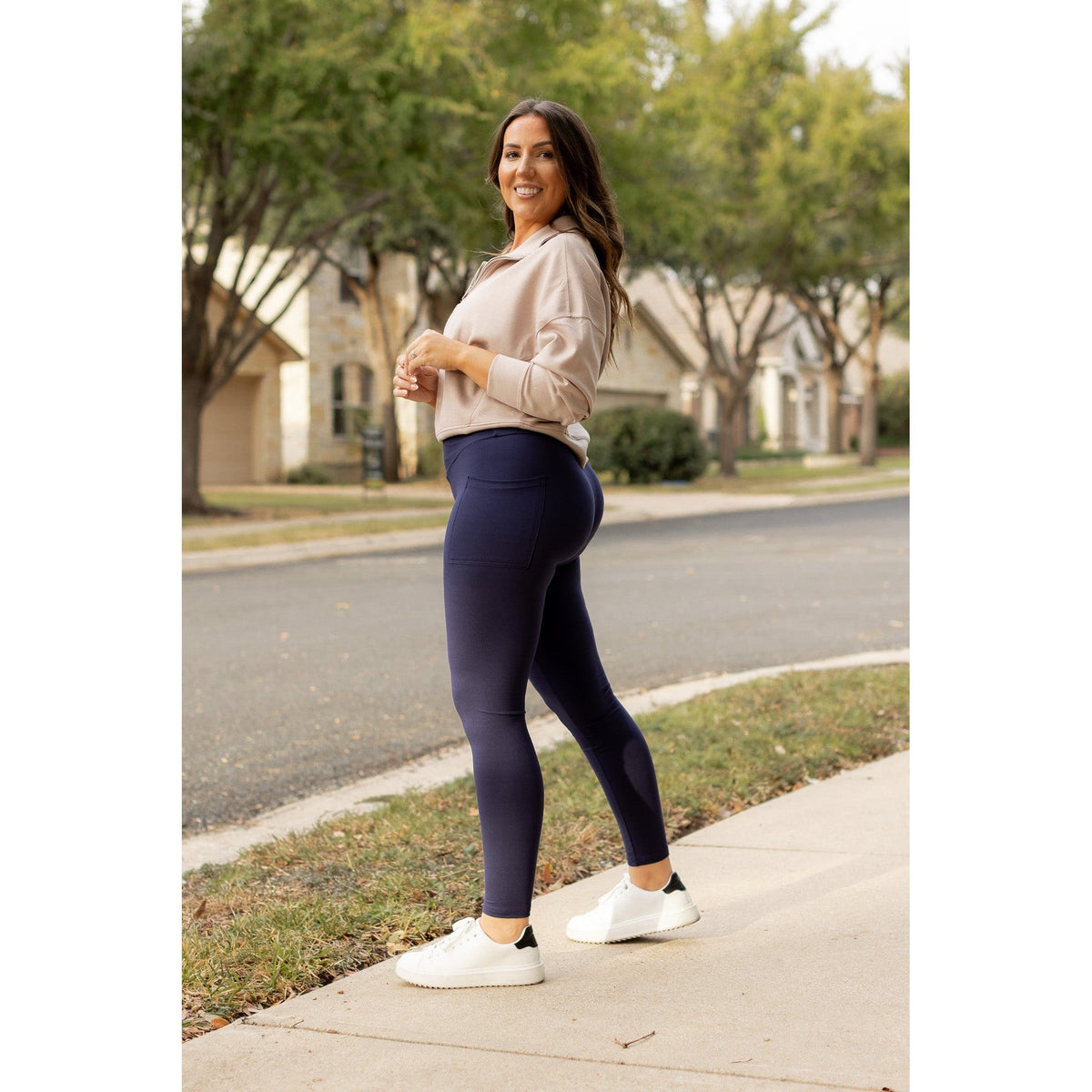 High-waisted navy crossover leggings with pockets by Julia Rose, Julia Rose women’s navy full length leggings lifestyle image