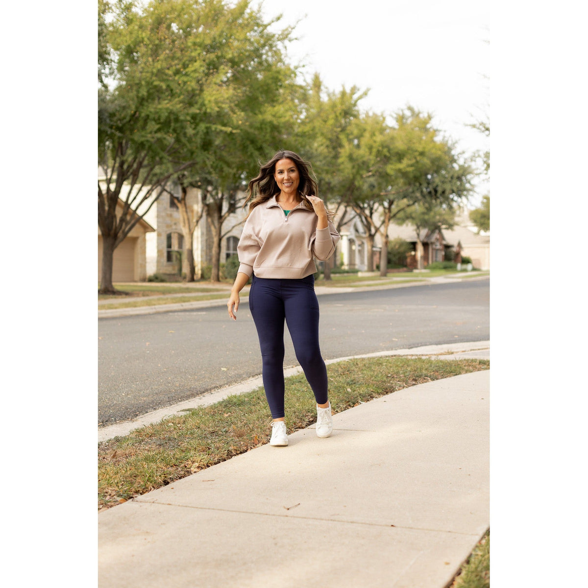 High-waisted navy crossover leggings with pockets by Julia Rose, Julia Rose women’s navy full length leggings lifestyle image