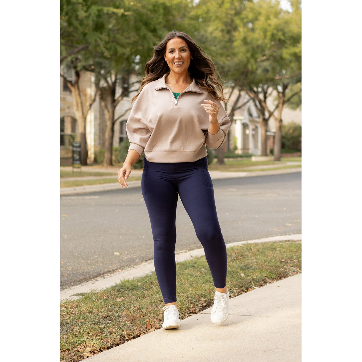 High-waisted navy crossover leggings with pockets by Julia Rose, Julia Rose women’s navy full length leggings lifestyle image