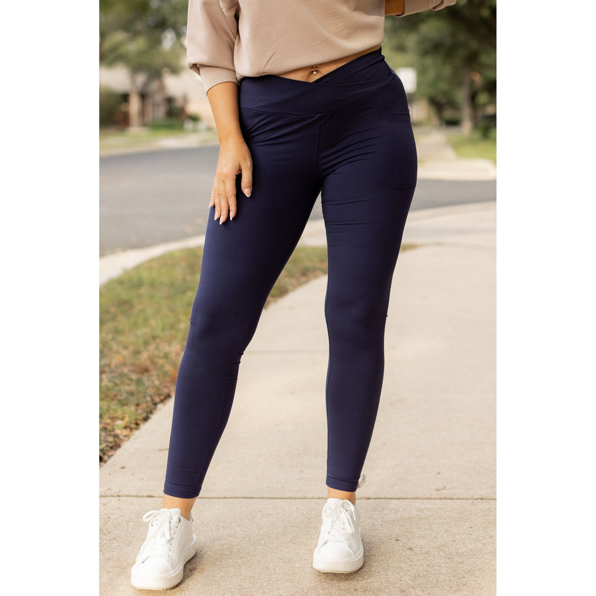 High-waisted navy crossover leggings with pockets by Julia Rose, Julia Rose women’s navy full length leggings lifestyle image