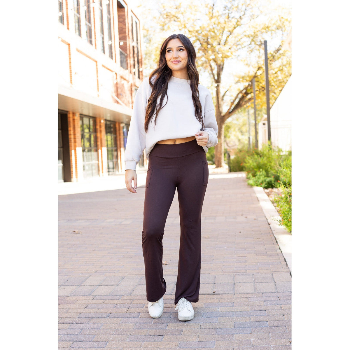 High-waisted brown bootcut leggings with pockets by Julia Rose, Julia Rose women’s brown flared leggings lifestyle image