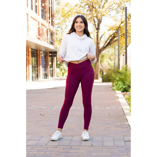 High-waisted maroon crossover leggings with pockets by Julia Rose, Julia Rose women’s maroon full length leggings lifestyle image