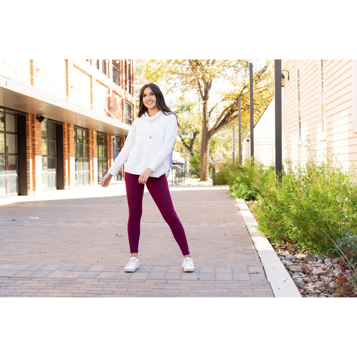 High-waisted maroon crossover leggings with pockets by Julia Rose, Julia Rose women’s maroon full length leggings lifestyle image