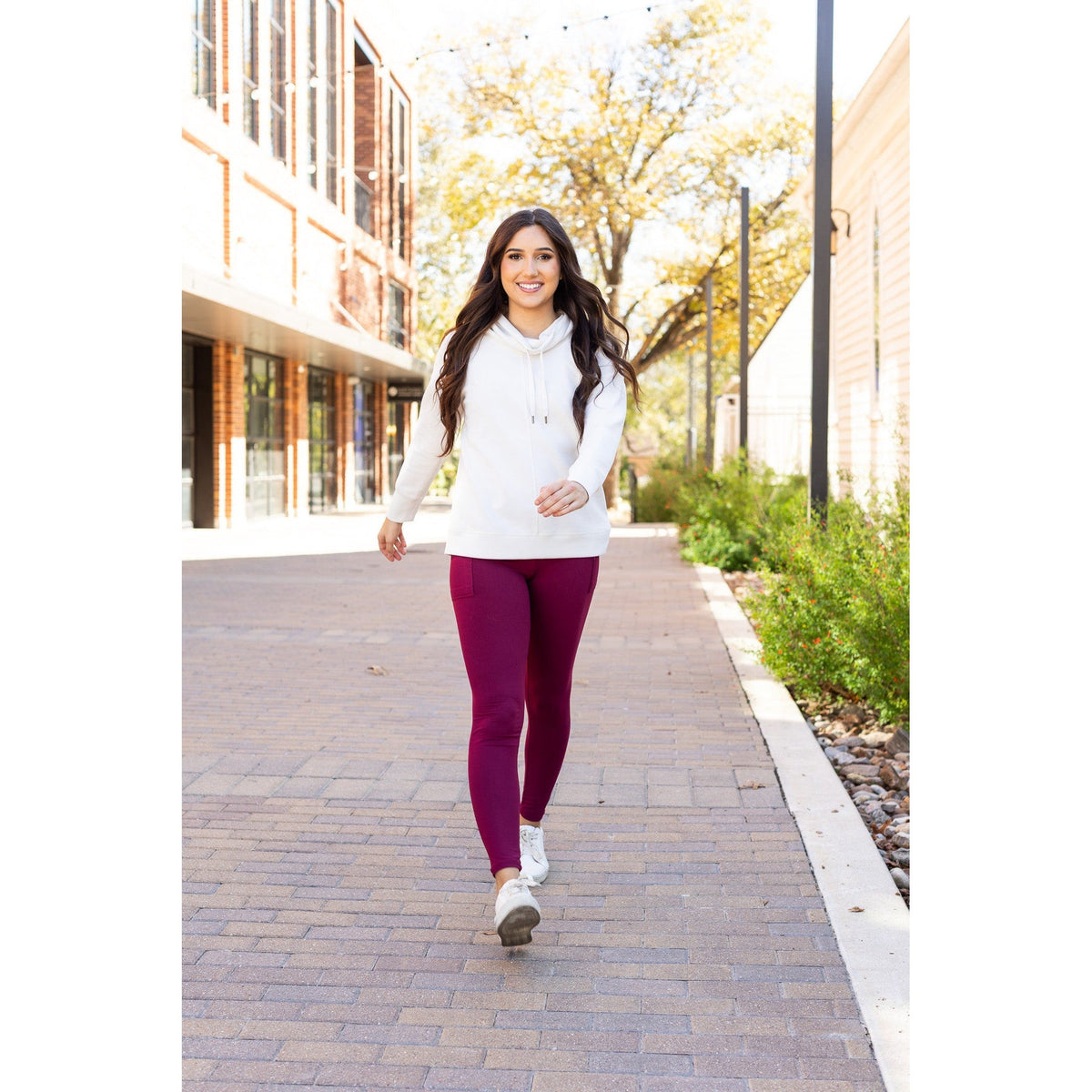 High-waisted maroon crossover leggings with pockets by Julia Rose, Julia Rose women’s maroon full length leggings lifestyle image