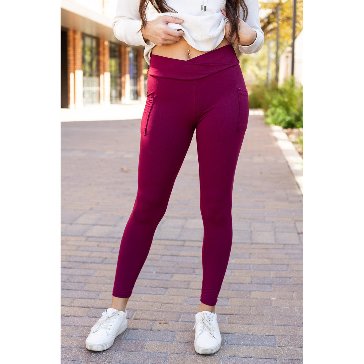 High-waisted maroon crossover leggings with pockets by Julia Rose, Julia Rose women’s maroon full length leggings lifestyle image