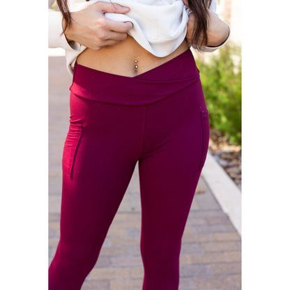 High-waisted maroon crossover leggings with pockets by Julia Rose, Julia Rose women’s maroon full length leggings lifestyle image