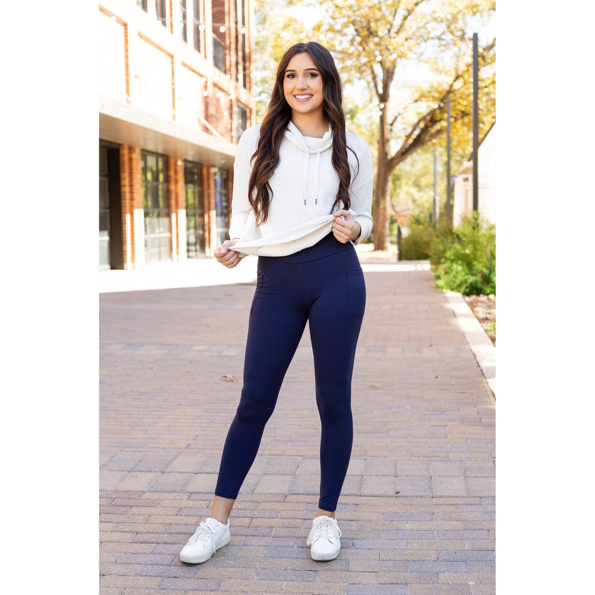 High-waisted navy crossover leggings with pockets by Julia Rose, Julia Rose women’s navy full length leggings lifestyle image