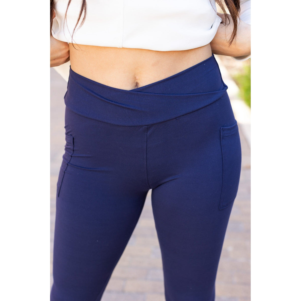High-waisted navy crossover leggings with pockets by Julia Rose, Julia Rose women’s navy full length leggings lifestyle image