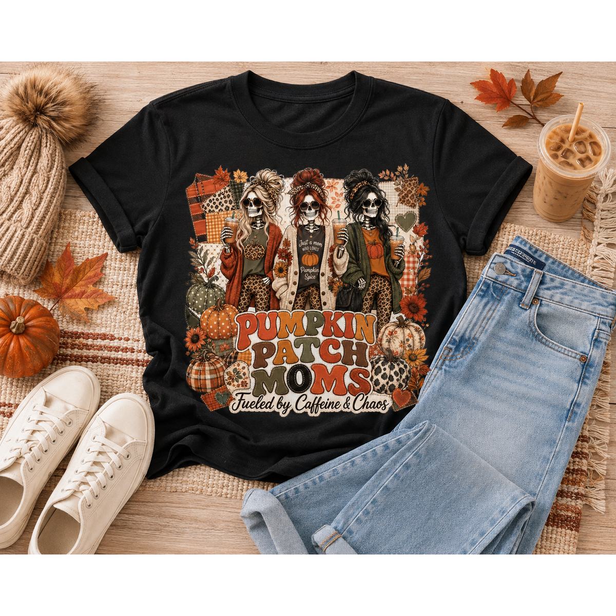 Pumpkin Patch Moms apparel with three skeleton moms, pumpkins and the phrase Fueled by Caffeine and Chaos, available in sizes S–3XL.
