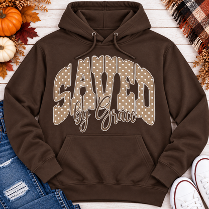 Saved by Grace faith graphic apparel with polka dot lettering, available in brown, navy and black V-neck, long sleeve, crewneck and hoodie styles.