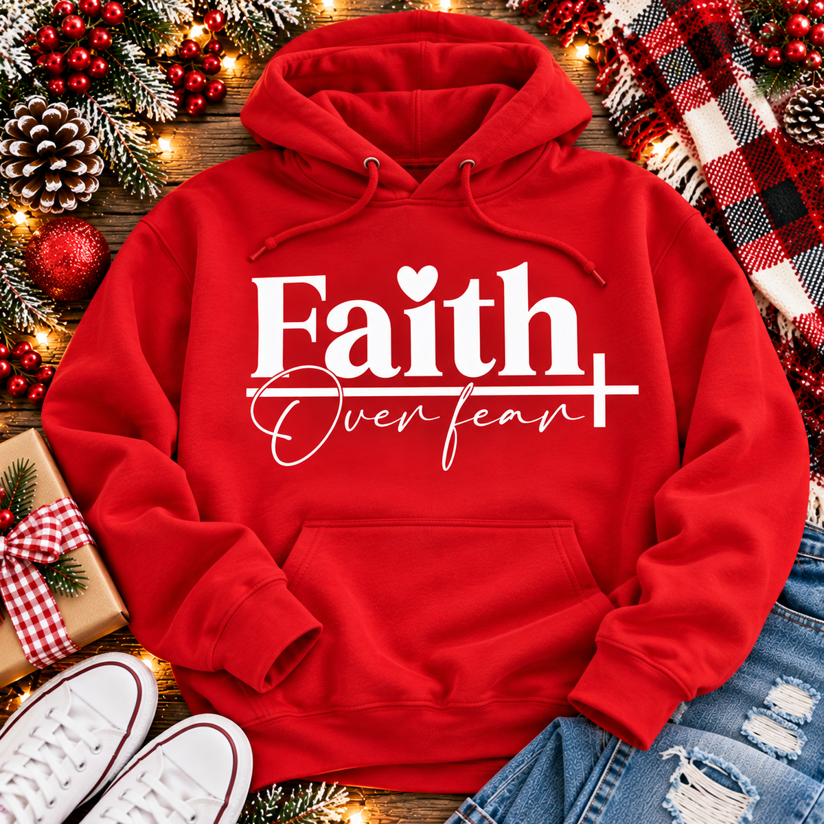 Faith Over Fear Christian inspirational graphic apparel featuring bold white Faith lettering, elegant Over Fear script, a small heart, and a cross design. Available in red and black in short sleeve crewneck, long sleeve crewneck, crewneck sweatshirt, and hoodie styles. Faith-based graphic clothing for women, everyday wear, church outfits, and inspirational gifts.