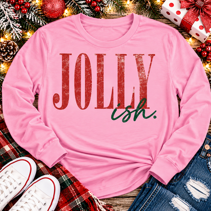 Jolly Ish Christmas graphic shirt featuring large distressed red JOLLY lettering with green handwritten ish script. Funny vintage-inspired holiday apparel available in pink and black, offered in short sleeve crewneck, V-neck, long sleeve and hoodie styles.