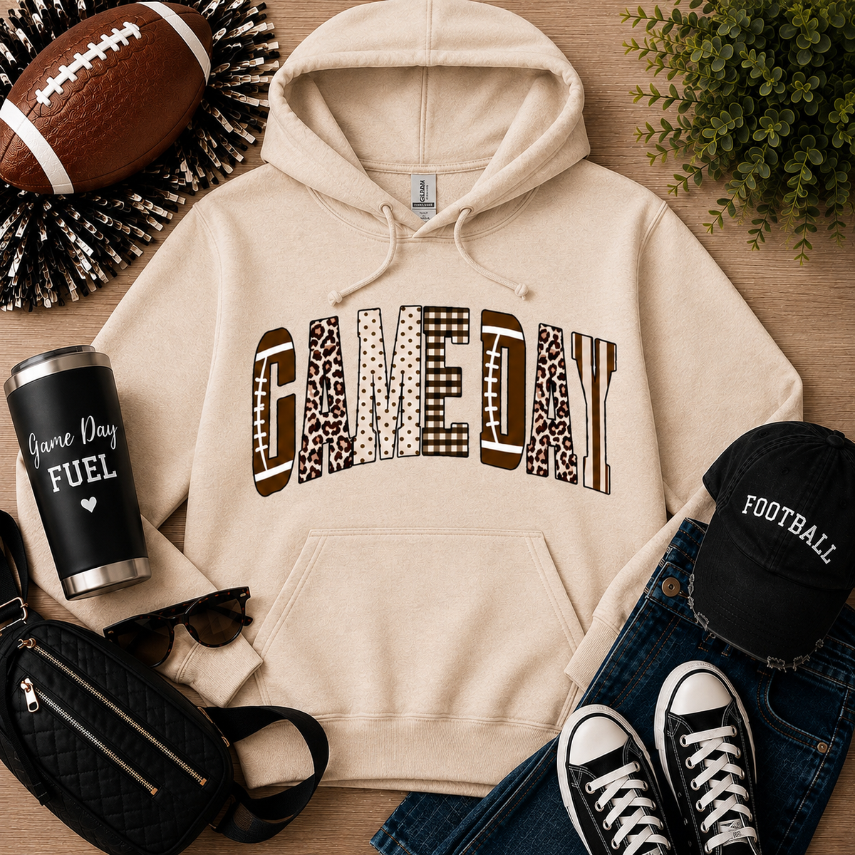 Julia Rose Game Day apparel featuring a football-inspired GAMEDAY graphic with leopard, polka-dot, gingham and striped details.