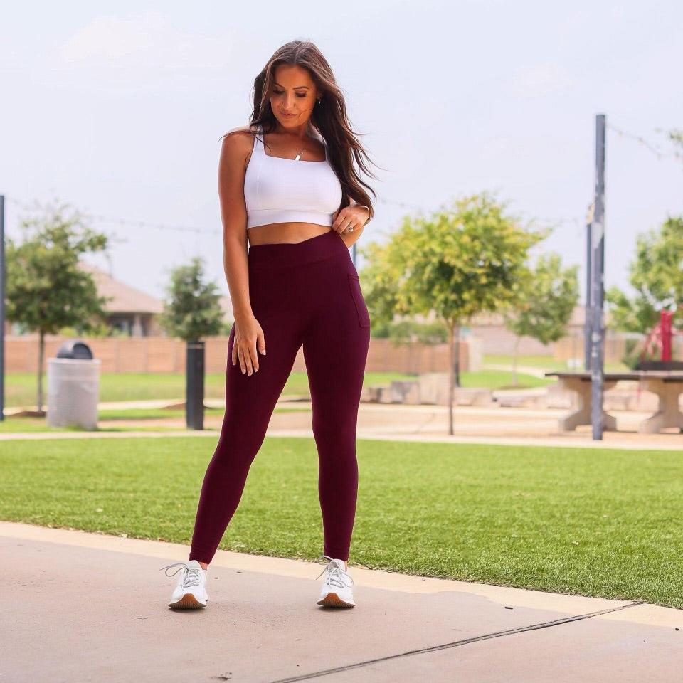 High-waisted maroon crossover leggings with pockets by Julia Rose, Julia Rose women’s maroon full length leggings lifestyle image