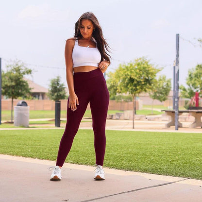 High-waisted maroon crossover leggings with pockets by Julia Rose, Julia Rose women’s maroon full length leggings lifestyle image