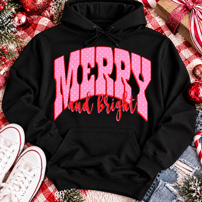 Merry and Bright Christmas graphic apparel with oversized pink polka dot lettering and festive holiday design