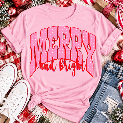 Merry and Bright Christmas graphic apparel with oversized pink polka dot lettering and festive holiday design