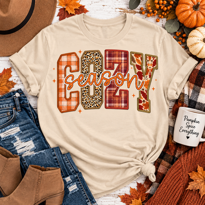 Cream crewneck Cozy Season fall graphic tee with plaid, leopard and autumn print lettering