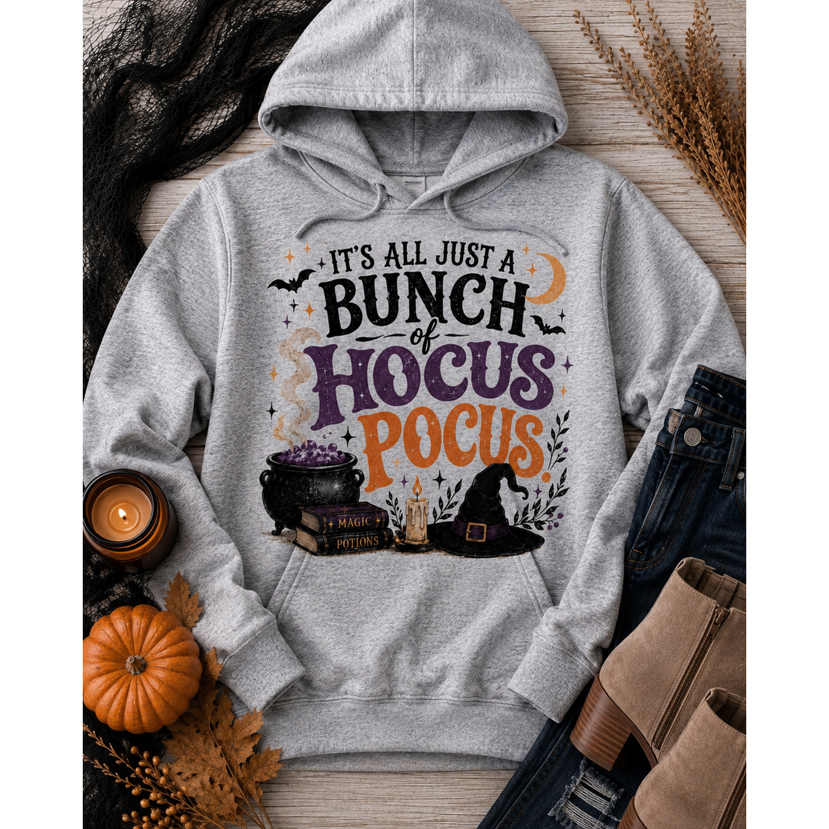 Hocus Pocus Halloween graphic hoodie featuring witch hat, cauldron, bats and spell books