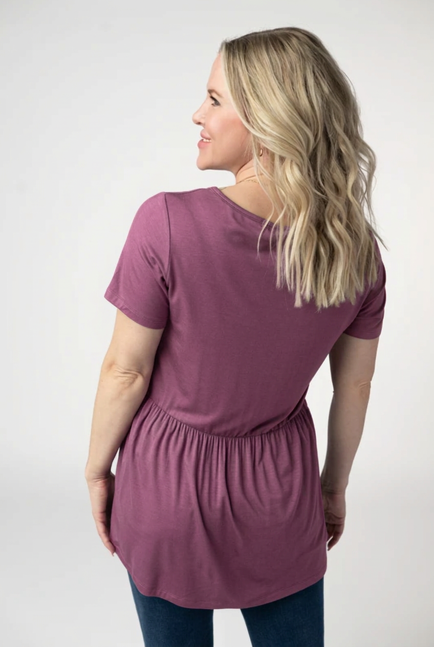 AI color mockup of the Sarah Ruffle Top in Mulberry, back view
